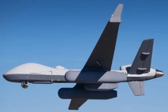 MQ-9B uncrewed aircraft carrying Saab LoyalEye airborne early warning radar pods in flight over a blue sky