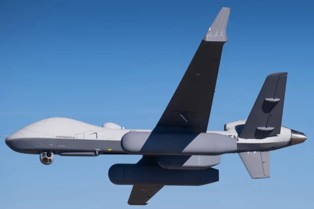 MQ-9B uncrewed aircraft carrying Saab LoyalEye airborne early warning radar pods in flight over a blue sky